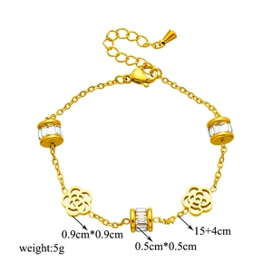 Elegant gold titanium steel bracelet featuring hollow flower charms and zircon beads