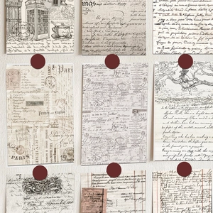 Detail of vintage postcards with French letters and Paris maps for wall decoration