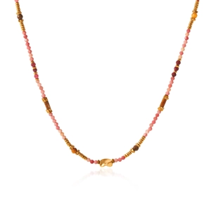 Detail of colorful beaded necklace featuring gold-tone irregular pendant on white background