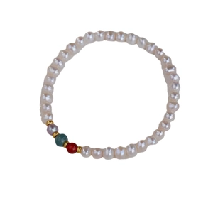 Elegant natural freshwater pearl bracelet with colorful agate beads and gold spacers on white