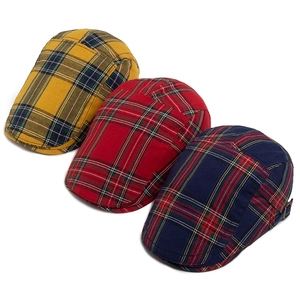 Three vintage plaid newsboy caps in classic British style for men and women on white background