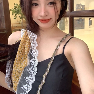 Floral print triangle bandana with lace trim on a black camisole dress for summer