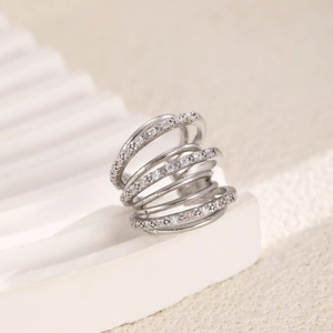 Macro shot of silver multi-layer spiral ear cuff with sparkling zircon micro-paving