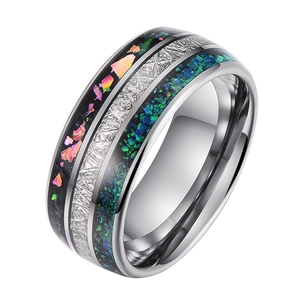 Men's tungsten ring with opal inlay and meteorite texture in a 45-degree side view