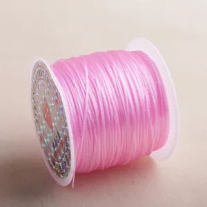 Pink flat crystal stretchy bead cord on a spool for jewelry making, 100% polyurethane