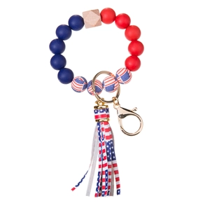 Dettaglio portachiavi nappina bandiera USA con perline in silicone rosso e blu navy e oro
