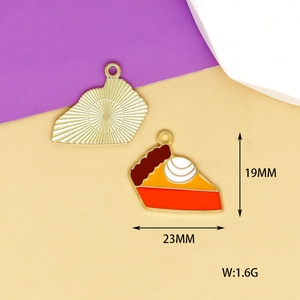 Macro view of slice cake enamel charms with 23mm width and 19mm height detail