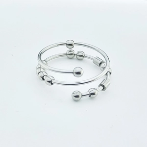 Detail of adjustable stainless steel fidget ring with rotatable beads for anxiety relief