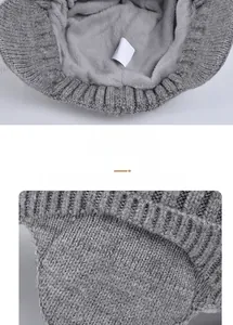 Close-up of thick fleece lining and knitted texture of gray winter earflap hat