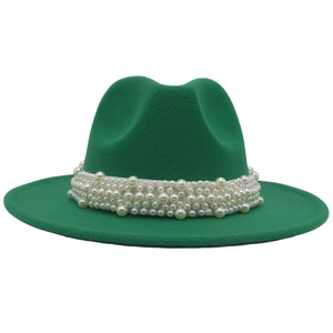 Close-up of green wool fedora hat featuring elegant white pearl band embellishments