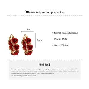 Detail of red rose earrings in copper with rhinestones showing size and specifications