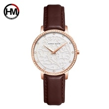 Detail of Hannah Martin watch featuring floral embossed dial and rose gold crystal bezel