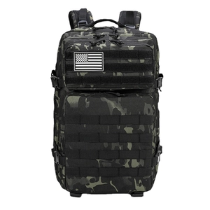 Tactical camouflage backpack with MOLLE system and American flag patch on white background