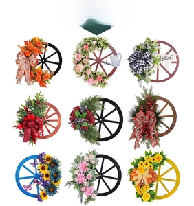Detail view of rustic wooden wheel wreaths with various seasonal floral and festive designs