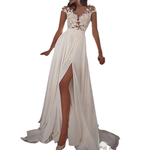 White lace evening gown featuring a mesh bodice and a flowing chiffon high slit skirt