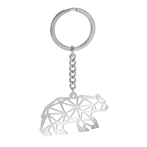 Minimalist geometric hollow bear keychain made of polished stainless steel on white background