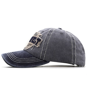 Macro side view of vintage baseball cap with distressed edges and contrast stitching details