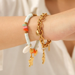 18k gold stainless steel starfish and shell bracelet set with blue beads on wrist