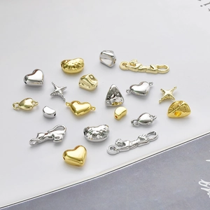 DIY jewelry charms in gold and silver featuring heart, star, and leopard alloy designs