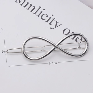 Silver infinity shaped metal hair clip detail with dimensions 6.7cm length and 2cm height