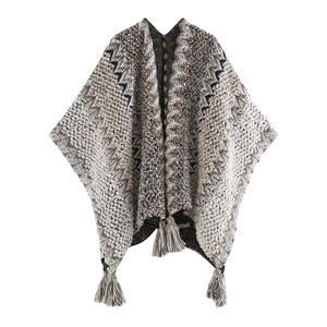 Ethnic style knitted shawl cape with geometric waves and tassels in brown and beige