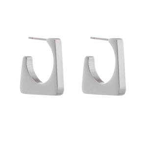 Macro detail of geometric square hollow earrings in silver matte stainless steel