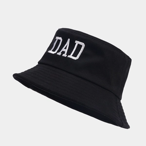 Close-up of DAD embroidery on black cotton bucket hat with detailed stitching and texture