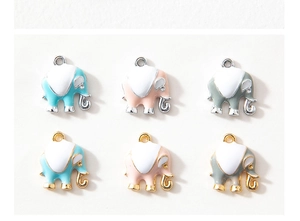 Detail of colorful elephant charms in gold and silver finish for DIY jewelry