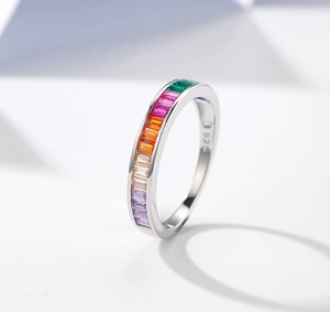 Macro shot of S925 silver ring featuring rainbow colored baguette gemstones with 925 stamp