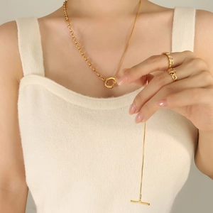 Gold plated OT buckle layered necklace with snake chain and ring on female model