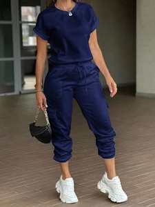 Detail view of navy blue two-piece casual set featuring cargo pockets and drawstring waist