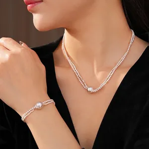 French vintage pearl necklace and bracelet set with silver metallic circular pendants