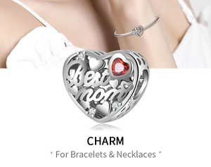 Detail view of S925 sterling silver Best Mom heart charm with red gem for bracelets