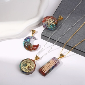 Chakra resin pendants with natural crystals and Tree of Life symbols on metal chains
