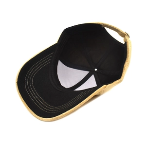 Interior detail of sequined baseball cap with black lining and adjustable back strap