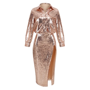 Detail of rose gold sequin set featuring long-sleeve shirt and side slit maxi skirt
