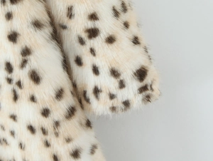 Detailed view of the leopard print faux fur coat texture and sleeve stitching detail
