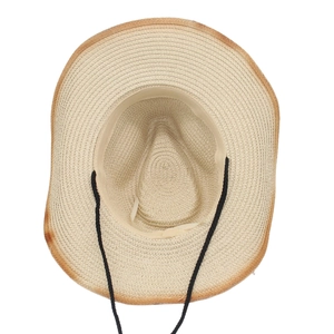 Close-up of straw cowboy hat featuring a black chin strap and dark brown ombré brim
