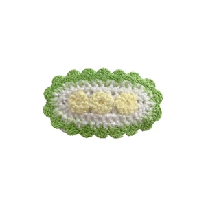 Handmade knitted flower hair clip with white base and green wave trim for girls