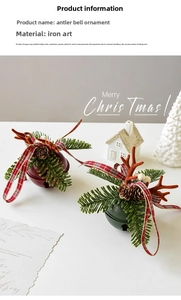 Close-up of red and green metal Christmas bells with antlers and pine cone accents