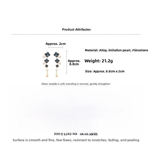 Detail view of crystal earrings with blue stones and pearls, size 8.8cm by 2cm