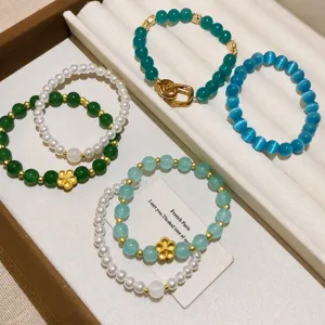 Elegantes pulseras de piedras naturales y perlas de estilo chino con dijes dorados