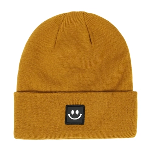 Detailed knit texture of ginger yellow beanie with a classic white smiley face patch