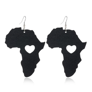 Detailed view of black wooden African map earrings with heart cutout and metal hooks