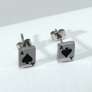 Macro view of stainless steel Ace of Spades stud earrings with black card engraving