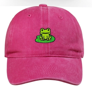 Close-up of green frog embroidery on magenta washed cotton vintage baseball cap