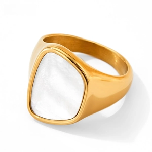 Detailed view of irregular triangle white mother of pearl inlay on gold stainless steel ring