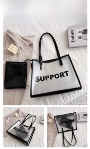 Detailed view of transparent PVC tote bag with black inner pouch and Support lettering