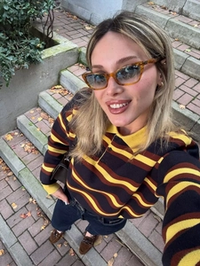 Detail of the wave stripe pattern and polo collar on this autumn knitted long sleeve top