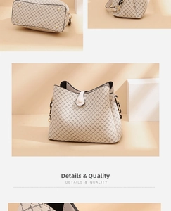 Detailed macro view of the beige monogram pattern and gold chain on the bucket bag